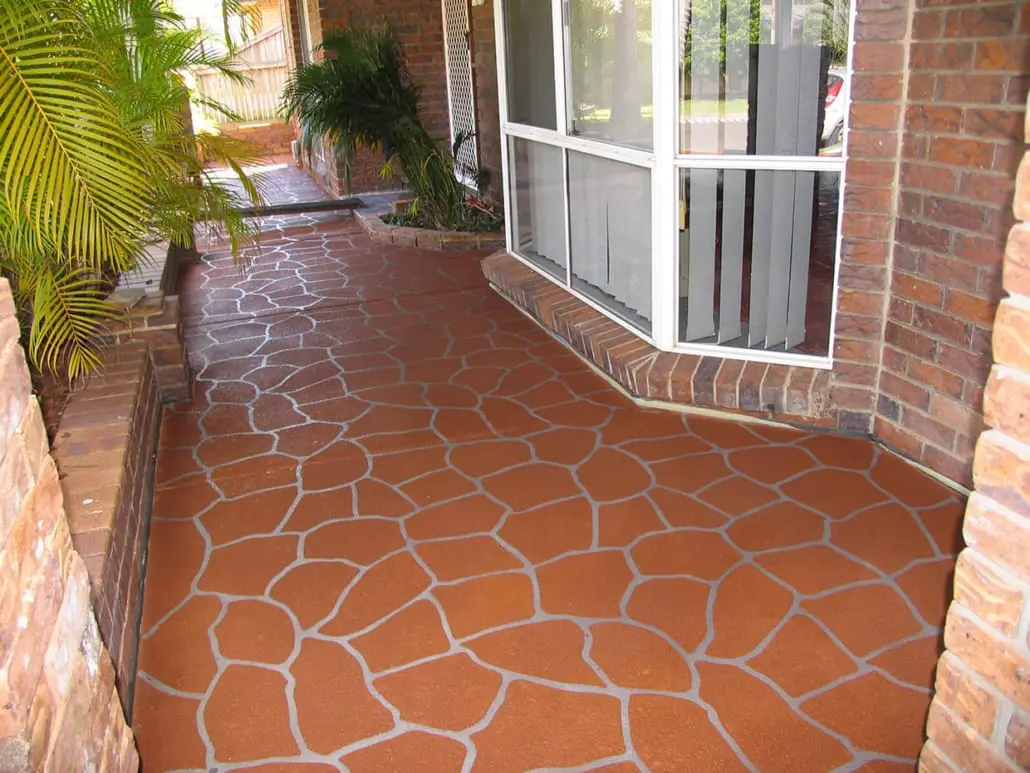 Terracotta bush rock crazy paving pattern in decorative concrete