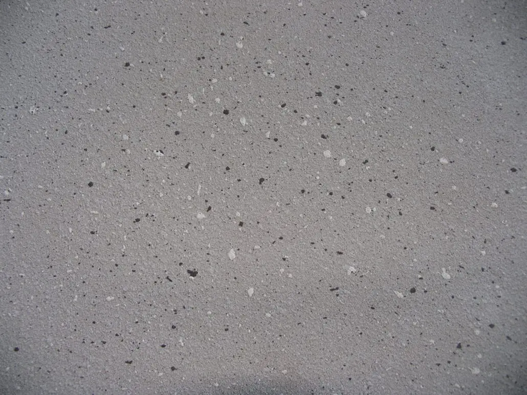 Close-up of a grey speckled decorative concrete finish