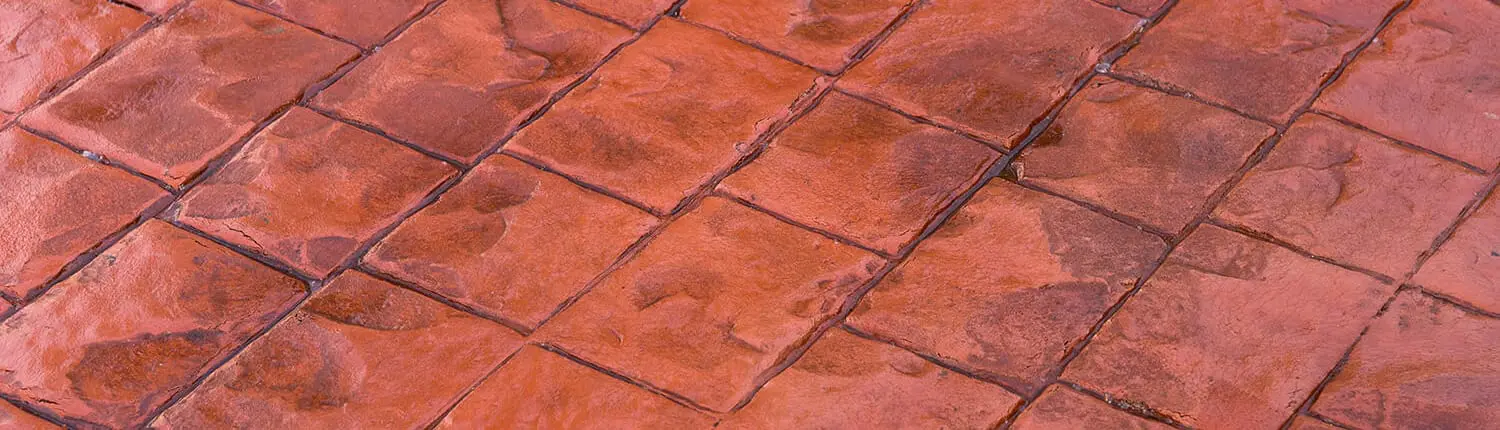 Close-up of a terracotta decorative concrete surface in a stone-look tile pattern
